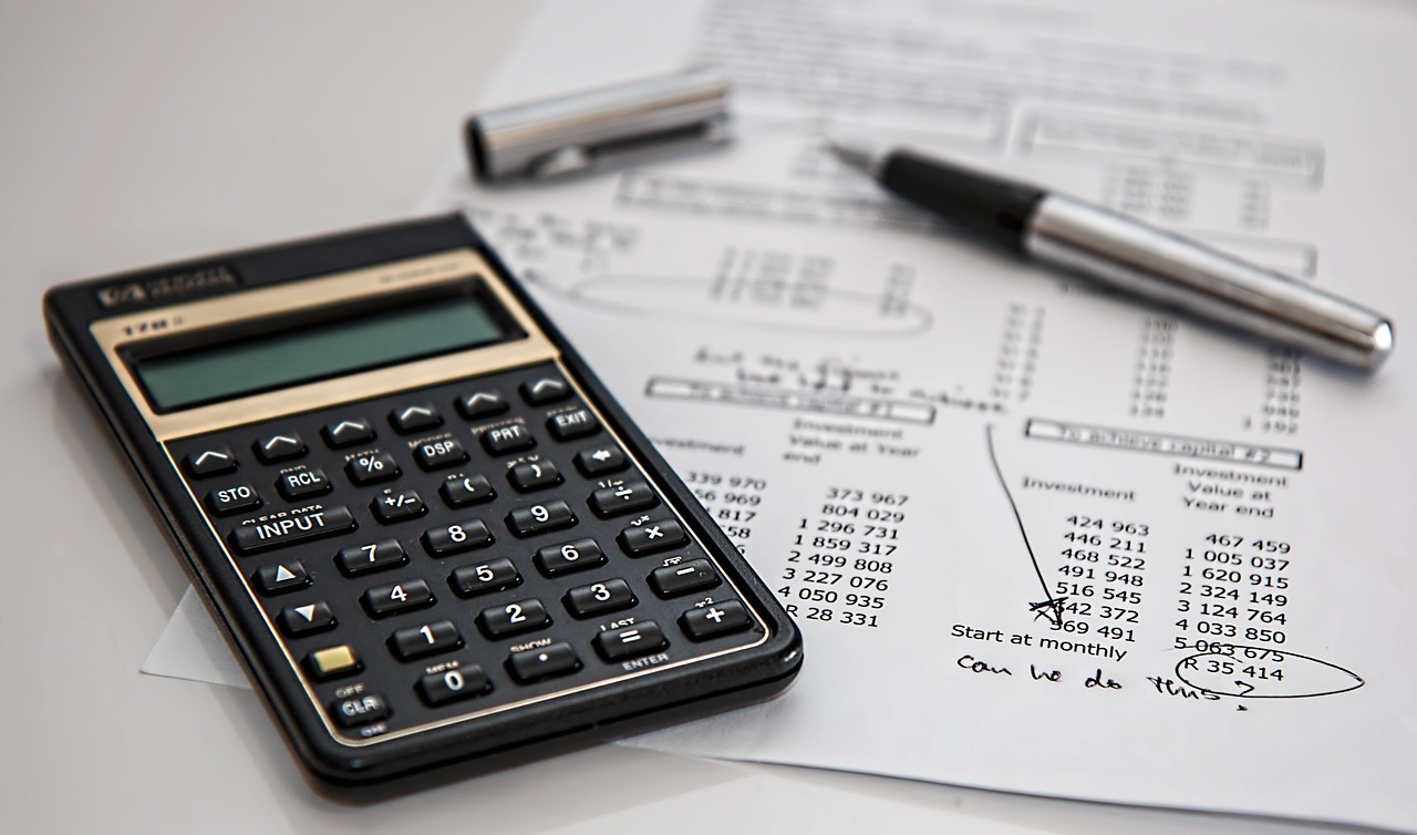 Financial calculator and notebook — arbitrage in sportsbooks borrows directly from the inverse-probability math of derivatives desks