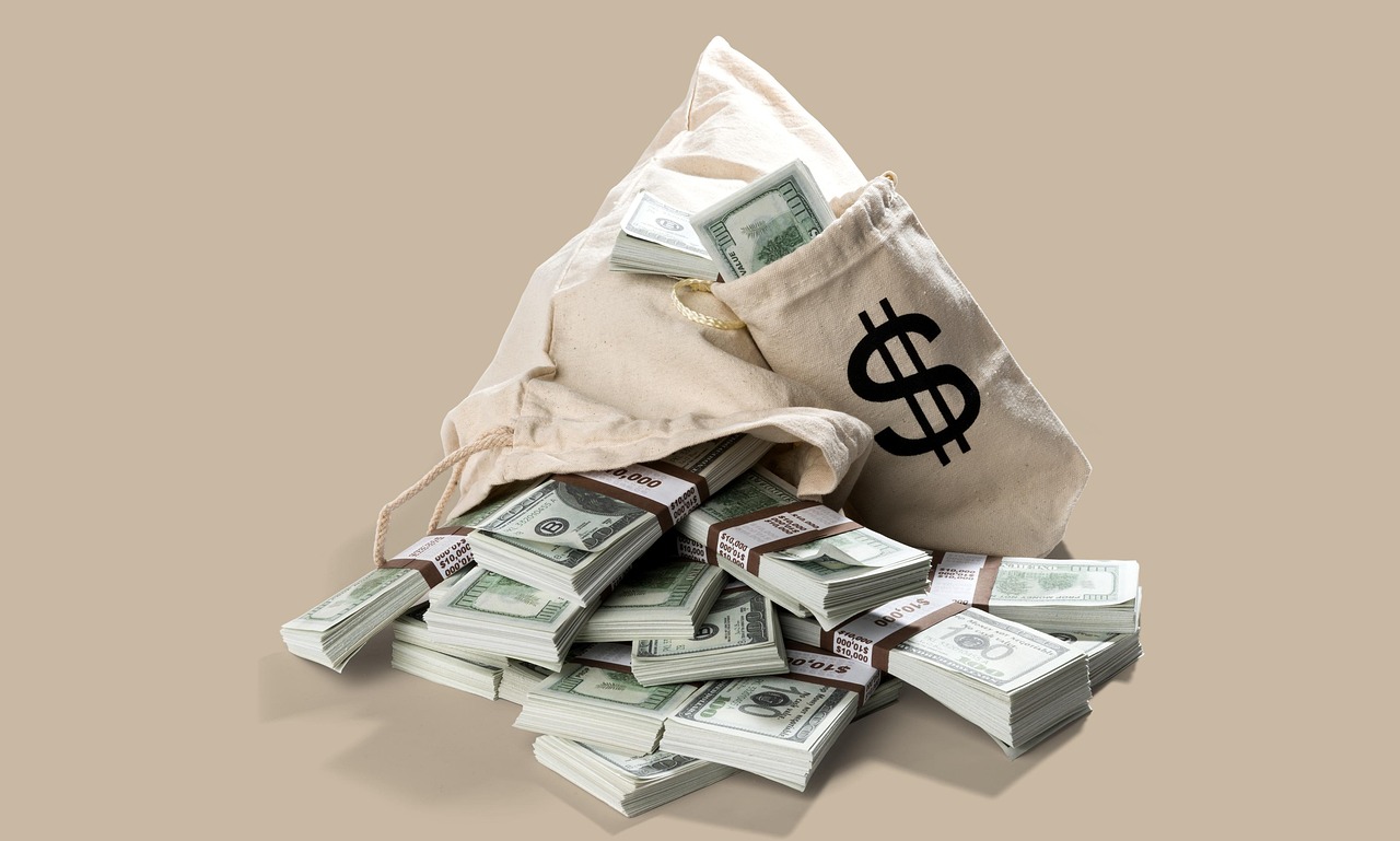 US currency stacked on a desk — the moneyline is the dollars-and-cents version of every game's win probability