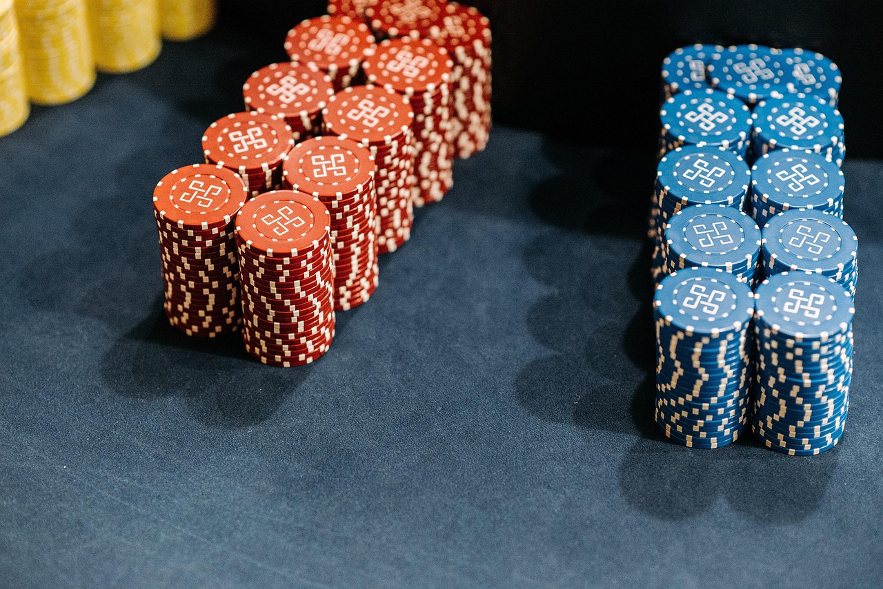 Casino chips stacked on a betting surface — parlay handle is dominated by chips that won't come back
