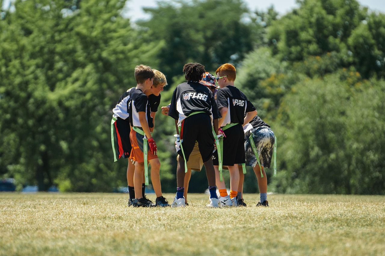 American football field with yard markings — the spread translates uneven teams into a single tradable number